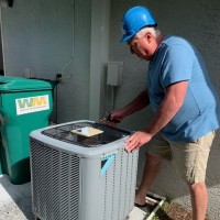 See It All Owner Robert Allen doing an air conditioning inspection